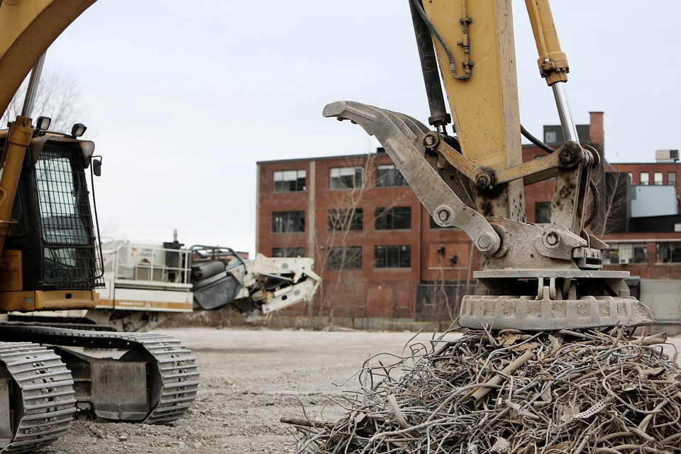 industrial magnet picking up scrap metal